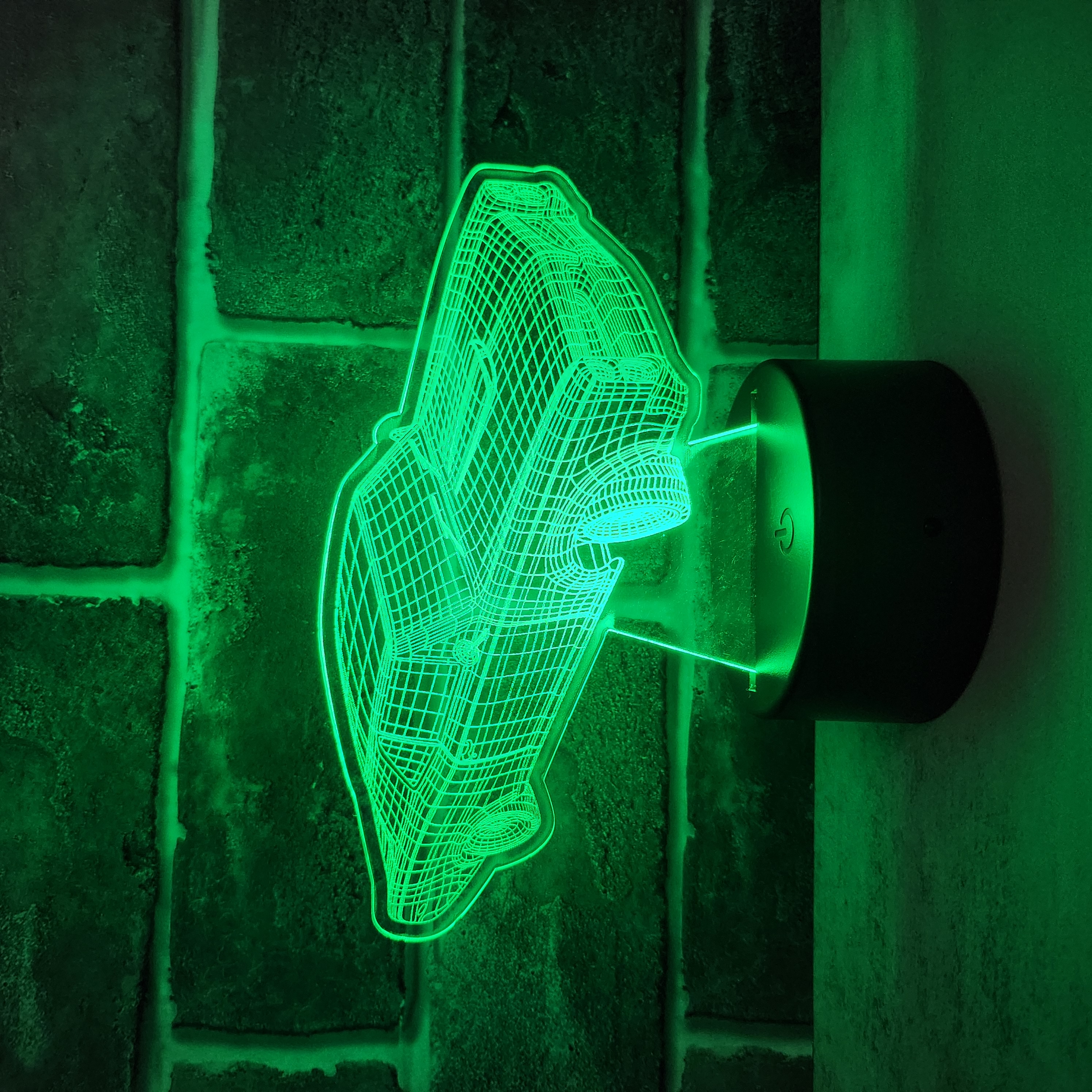 Custom LED light showing a car engraved in acrylic